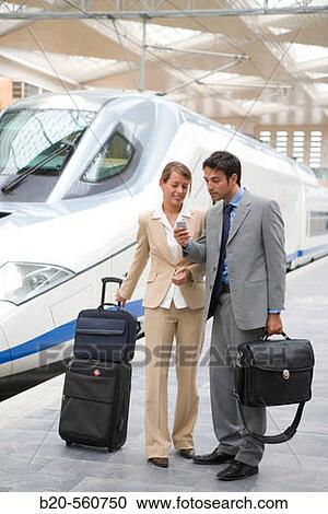 Businessmen. Travelers. AVE, Tren de Alta Velocidad. Delicias station, Zaragoza, Arag? n. Spain. View Large Photo Image Stock Image - Businessmen. Travelers. AVE, Tren de Alta Velocidad. Delicias station, Zaragoza, Arag? n. Spain.. Fotosearch