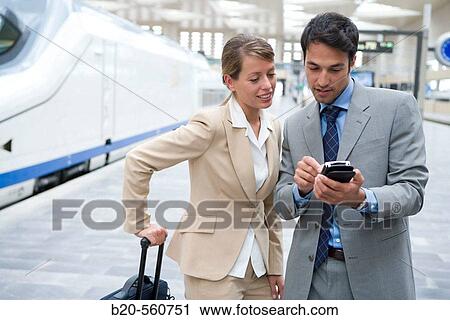 Businessmen. Travelers. AVE, Tren de Alta Velocidad. Delicias station, Zaragoza, Arag? n. Spain. View Large Photo Image Stock Image - Businessmen. Travelers. AVE, Tren de Alta Velocidad. Delicias station, Zaragoza, Arag? n. Spain.. Fotosearch