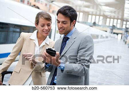 Businessmen. Travelers. AVE, Tren de Alta Velocidad. Delicias station, Zaragoza, Arag? n. Spain. View Large Photo Image Stock Image - Businessmen. Travelers. AVE, Tren de Alta Velocidad. Delicias station, Zaragoza, Arag? n. Spain.. Fotosearch