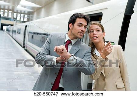 Businessmen. Travelers. AVE, Tren de Alta Velocidad. Delicias station, Zaragoza, Arag? n. Spain. View Large Photo Image Stock Photo - Businessmen. Travelers. AVE, Tren de Alta Velocidad. Delicias station, Zaragoza, Arag? n. Spain.. Fotosearch