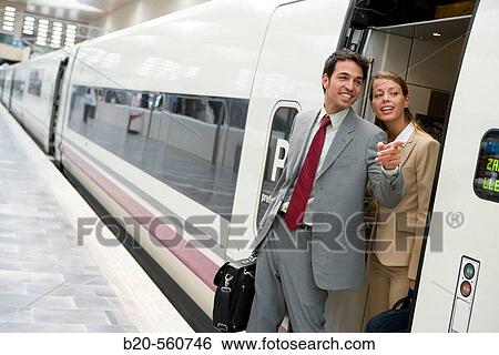 Businessmen. Travelers. AVE, Tren de Alta Velocidad. Delicias station, Zaragoza, Arag? n. Spain. View Large Photo Image Stock Photograph - Businessmen. Travelers. AVE, Tren de Alta Velocidad. Delicias station, Zaragoza, Arag? n. Spain.. Fotosearch