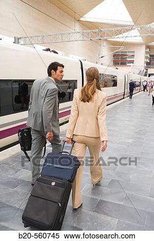 Businessmen. Travelers. AVE, Tren de Alta Velocidad. Delicias station, Zaragoza, Arag? n. Spain. View Large Photo Image Stock Photography - Businessmen. Travelers. AVE, Tren de Alta Velocidad. Delicias station, Zaragoza, Arag? n. Spain.. Fotosearch
