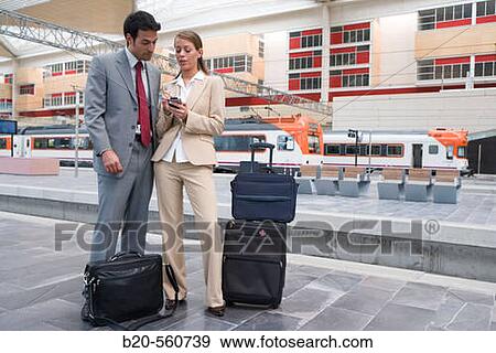 Businessmen. Travelers. Delicias station, Zaragoza, Arag? n. Spain. View Large Photo Image Stock Photo - Businessmen. Travelers. Delicias station, Zaragoza, Arag? n. Spain.. Fotosearch
