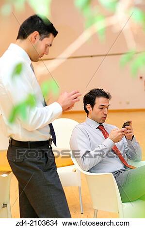 Businessmen using smartphones View Large Photo Image Picture - Businessmen using smartphones. Fotosearch