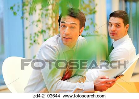 Businessmen using smartphones View Large Photo Image Picture - Businessmen using smartphones. Fotosearch