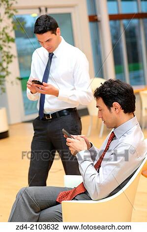 Businessmen using smartphones View Large Photo Image Stock Image - Businessmen using smartphones. Fotosearch