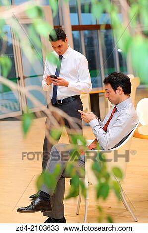 Businessmen using smartphones View Large Photo Image Stock Image - Businessmen using smartphones. Fotosearch
