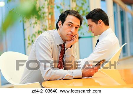 Businessmen using smartphones View Large Photo Image Stock Image - Businessmen using smartphones. Fotosearch