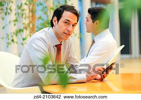 Businessmen using smartphones View Large Photo Image Stock Image - Businessmen using smartphones. Fotosearch