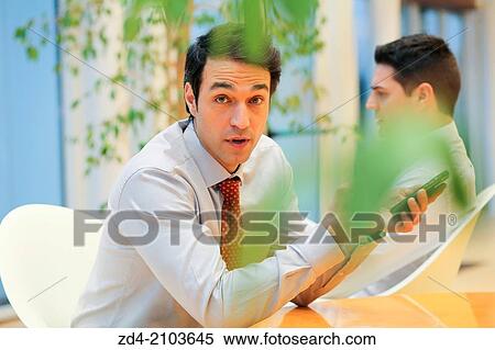 Businessmen using smartphones View Large Photo Image Stock Photography - Businessmen using smartphones. Fotosearch