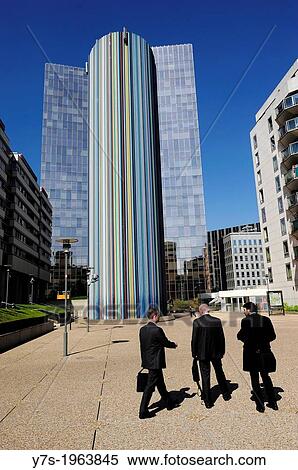 Businessmen walking in the main square of La Defense district in the westernmost part of Paris, France, Europe. View Large Photo Image Stock Photography - Businessmen walking in the main square of La Defense district in the westernmost part of Paris, France, Europe.. Fotosearch
