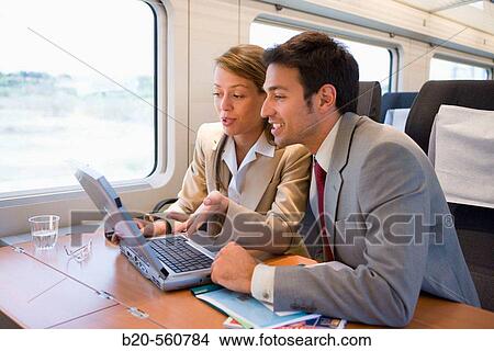 Businessmen working connected to the internet. Passenger. AVE, Tren de Alta Velocidad, Zaragoza, Arag? n. Spain. View Large Photo Image Picture - Businessmen working connected to the internet. Passenger. AVE, Tren de Alta Velocidad, Zaragoza, Arag? n. Spain.. Fotosearch