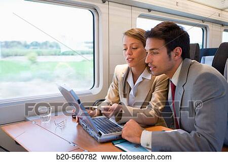 Businessmen working connected to the internet. Passenger. AVE, Tren de Alta Velocidad, Zaragoza, Arag? n. Spain. View Large Photo Image Stock Image - Businessmen working connected to the internet. Passenger. AVE, Tren de Alta Velocidad, Zaragoza, Arag? n. Spain.. Fotosearch