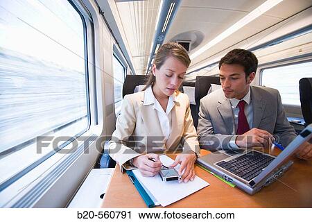 Businessmen working connected to the internet. Passenger. AVE, Tren de Alta Velocidad, Zaragoza, Arag? n. Spain. View Large Photo Image Stock Image - Businessmen working connected to the internet. Passenger. AVE, Tren de Alta Velocidad, Zaragoza, Arag? n. Spain.. Fotosearch