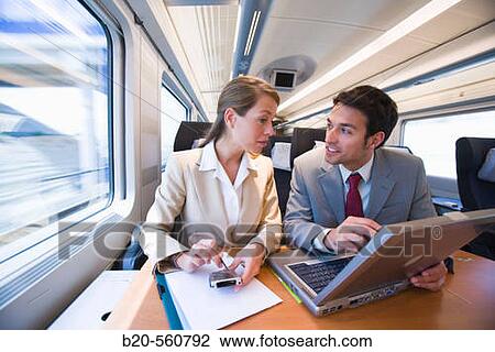 Stock Image - Businessmen working connected to the internet. Passenger. AVE, Tren de Alta Velocidad, Zaragoza, Arag? n. Spain.. Fotosearch