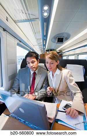 Businessmen working connected to the internet. Passenger. AVE, Tren de Alta Velocidad, Zaragoza, Arag? n. Spain. View Large Photo Image Stock Image - Businessmen working connected to the internet. Passenger. AVE, Tren de Alta Velocidad, Zaragoza, Arag? n. Spain.. Fotosearch