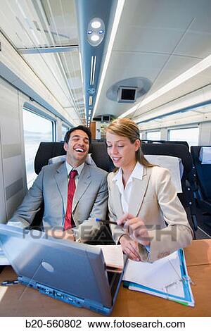 Businessmen working connected to the internet. Passenger. AVE, Tren de Alta Velocidad, Zaragoza, Arag? n. Spain. View Large Photo Image Stock Image - Businessmen working connected to the internet. Passenger. AVE, Tren de Alta Velocidad, Zaragoza, Arag? n. Spain.. Fotosearch