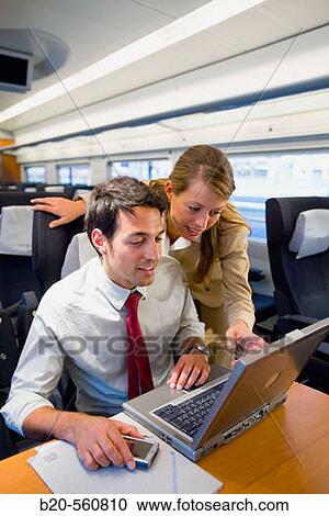 Businessmen working connected to the internet. Passenger. AVE, Tren de Alta Velocidad, Zaragoza, Arag? n. Spain. View Large Photo Image Stock Image - Businessmen working connected to the internet. Passenger. AVE, Tren de Alta Velocidad, Zaragoza, Arag? n. Spain.. Fotosearch