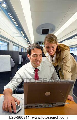 Businessmen working connected to the internet. Passenger. AVE, Tren de Alta Velocidad, Zaragoza, Arag? n. Spain. View Large Photo Image Stock Image - Businessmen working connected to the internet. Passenger. AVE, Tren de Alta Velocidad, Zaragoza, Arag? n. Spain.. Fotosearch