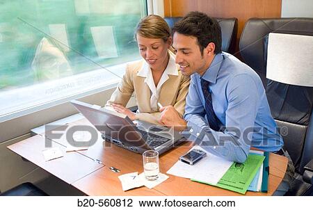 Businessmen working connected to the internet. Passenger. AVE, Tren de Alta Velocidad, Zaragoza, Arag? n. Spain. View Large Photo Image Stock Image - Businessmen working connected to the internet. Passenger. AVE, Tren de Alta Velocidad, Zaragoza, Arag? n. Spain.. Fotosearch