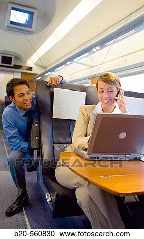 Businessmen working connected to the internet. Passenger. AVE, Tren de Alta Velocidad, Zaragoza, Arag? n. Spain. View Large Photo Image Stock Image - Businessmen working connected to the internet. Passenger. AVE, Tren de Alta Velocidad, Zaragoza, Arag? n. Spain.. Fotosearch