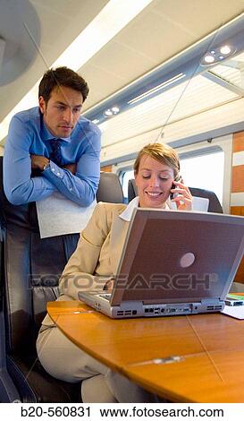Businessmen working connected to the internet. Passenger. AVE, Tren de Alta Velocidad, Zaragoza, Arag? n. Spain. View Large Photo Image Stock Image - Businessmen working connected to the internet. Passenger. AVE, Tren de Alta Velocidad, Zaragoza, Arag? n. Spain.. Fotosearch