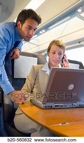 Businessmen working connected to the internet. Passenger. AVE, Tren de Alta Velocidad, Zaragoza, Arag? n. Spain. View Large Photo Image Stock Image - Businessmen working connected to the internet. Passenger. AVE, Tren de Alta Velocidad, Zaragoza, Arag? n. Spain.. Fotosearch
