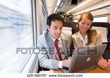 Businessmen working connected to the internet. Passenger. AVE, Tren de Alta Velocidad, Zaragoza, Arag? n. Spain. View Large Photo Image Stock Photo - Businessmen working connected to the internet. Passenger. AVE, Tren de Alta Velocidad, Zaragoza, Arag? n. Spain.. Fotosearch