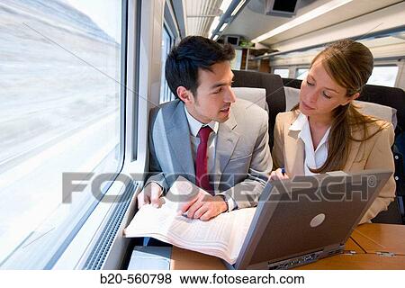 Businessmen working connected to the internet. Passenger. AVE, Tren de Alta Velocidad, Zaragoza, Arag? n. Spain. View Large Photo Image Stock Photo - Businessmen working connected to the internet. Passenger. AVE, Tren de Alta Velocidad, Zaragoza, Arag? n. Spain.. Fotosearch