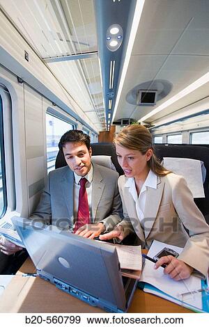 Businessmen working connected to the internet. Passenger. AVE, Tren de Alta Velocidad, Zaragoza, Arag? n. Spain. View Large Photo Image Stock Photo - Businessmen working connected to the internet. Passenger. AVE, Tren de Alta Velocidad, Zaragoza, Arag? n. Spain.. Fotosearch