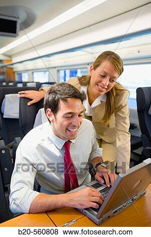 Businessmen working connected to the internet. Passenger. AVE, Tren de Alta Velocidad, Zaragoza, Arag? n. Spain. View Large Photo Image Stock Photo - Businessmen working connected to the internet. Passenger. AVE, Tren de Alta Velocidad, Zaragoza, Arag? n. Spain.. Fotosearch
