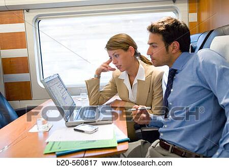 Businessmen working connected to the internet. Passenger. AVE, Tren de Alta Velocidad, Zaragoza, Arag? n. Spain. View Large Photo Image Stock Photo - Businessmen working connected to the internet. Passenger. AVE, Tren de Alta Velocidad, Zaragoza, Arag? n. Spain.. Fotosearch