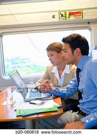Businessmen working connected to the internet. Passenger. AVE, Tren de Alta Velocidad, Zaragoza, Arag? n. Spain. View Large Photo Image Stock Photo - Businessmen working connected to the internet. Passenger. AVE, Tren de Alta Velocidad, Zaragoza, Arag? n. Spain.. Fotosearch