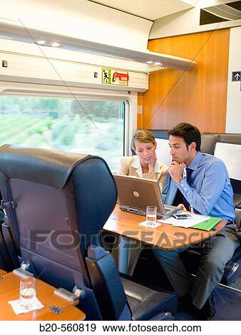 Businessmen working connected to the internet. Passenger. AVE, Tren de Alta Velocidad, Zaragoza, Arag? n. Spain. View Large Photo Image Stock Photo - Businessmen working connected to the internet. Passenger. AVE, Tren de Alta Velocidad, Zaragoza, Arag? n. Spain.. Fotosearch