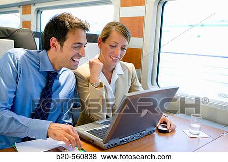 Businessmen working connected to the internet. Passenger. AVE, Tren de Alta Velocidad, Zaragoza, Arag? n. Spain. View Large Photo Image Stock Photo - Businessmen working connected to the internet. Passenger. AVE, Tren de Alta Velocidad, Zaragoza, Arag? n. Spain.. Fotosearch