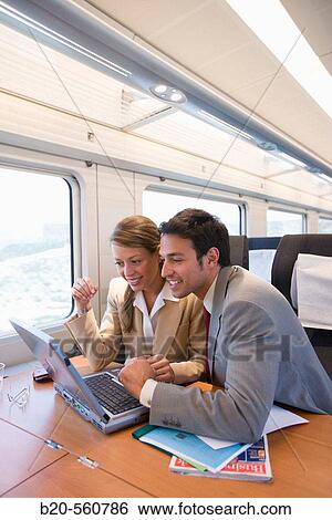 Businessmen working connected to the internet. Passenger. AVE, Tren de Alta Velocidad, Zaragoza, Arag? n. Spain. View Large Photo Image Stock Photograph - Businessmen working connected to the internet. Passenger. AVE, Tren de Alta Velocidad, Zaragoza, Arag? n. Spain.. Fotosearch
