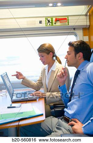 Businessmen working connected to the internet. Passenger. AVE, Tren de Alta Velocidad, Zaragoza, Arag? n. Spain. View Large Photo Image Stock Photograph - Businessmen working connected to the internet. Passenger. AVE, Tren de Alta Velocidad, Zaragoza, Arag? n. Spain.. Fotosearch
