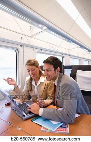 Businessmen working connected to the internet. Passenger. AVE, Tren de Alta Velocidad, Zaragoza, Arag? n. Spain. View Large Photo Image Stock Photography - Businessmen working connected to the internet. Passenger. AVE, Tren de Alta Velocidad, Zaragoza, Arag? n. Spain.. Fotosearch