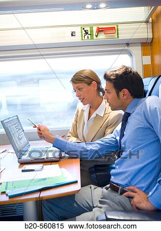 Businessmen working connected to the internet. Passenger. AVE, Tren de Alta Velocidad, Zaragoza, Arag? n. Spain. View Large Photo Image Stock Photography - Businessmen working connected to the internet. Passenger. AVE, Tren de Alta Velocidad, Zaragoza, Arag? n. Spain.. Fotosearch