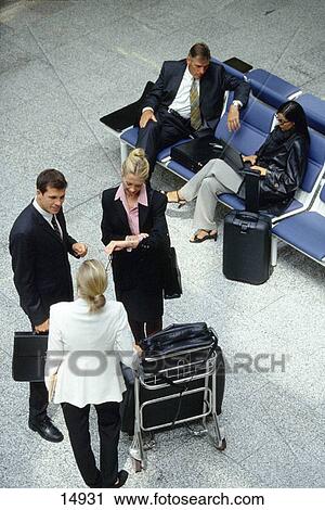 Stock Image - Businesspeople at the airport. Fotosearch