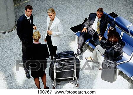 Stock Photo - Businesspeople at the airport. Fotosearch