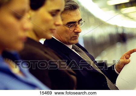 Stock Photo - Businesspeople at the airport. Fotosearch