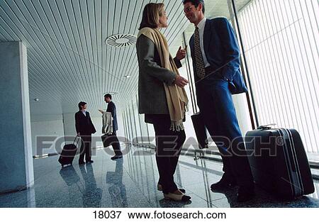 Businesspeople at the airport View Large Photo Image Stock Photo - Businesspeople at the airport. Fotosearch