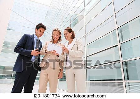 Businesspeople using digital tablet View Large Photo Image Picture - Businesspeople using digital tablet. Fotosearch