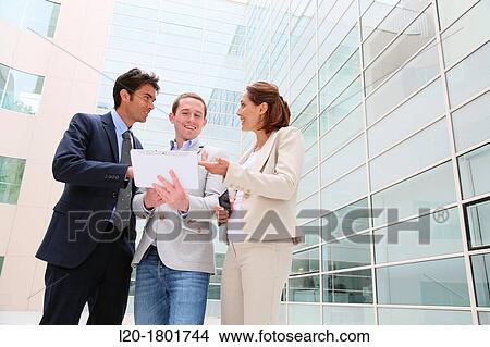 Businesspeople using digital tablet View Large Photo Image Picture - Businesspeople using digital tablet. Fotosearch