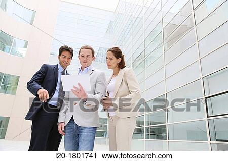 Businesspeople using digital tablet View Large Photo Image Stock Image - Businesspeople using digital tablet. Fotosearch