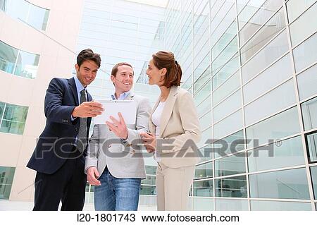 Businesspeople using digital tablet View Large Photo Image Stock Image - Businesspeople using digital tablet. Fotosearch