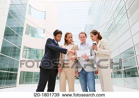 Businesspeople using digital tablet View Large Photo Image Stock Photo - Businesspeople using digital tablet. Fotosearch