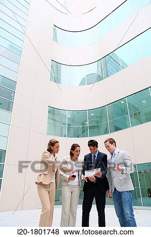 Businesspeople using digital tablet View Large Photo Image Stock Photo - Businesspeople using digital tablet. Fotosearch