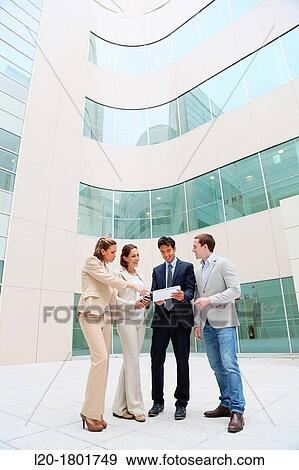 Businesspeople using digital tablet View Large Photo Image Stock Photo - Businesspeople using digital tablet. Fotosearch
